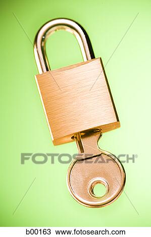 Close-up of a padlock with a key View Large Photo Image Stock Image - Close-up of a padlock with a key. Fotosearch