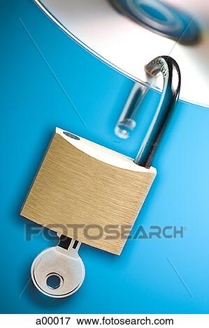 Stock Photo - Close-up of a padlock with keys hanging from a compact disk. Fotosearch