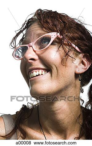 Close-up of a quirky adult woman smiling View Large Photo Image Stock Photo - Close-up of a quirky adult woman smiling. Fotosearch