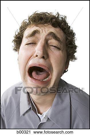 Close-up of a quirky young man crying View Large Photo Image Stock Image - Close-up of a quirky young man crying. Fotosearch
