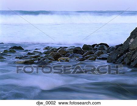 Stock Image - Close-up of a rocky shoreline. Fotosearch