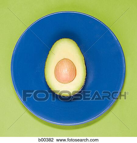 Close-up of a sliced avocado (Persea Americana) View Large Photo Image Stock Image - Close-up of a sliced avocado (Persea Americana). Fotosearch