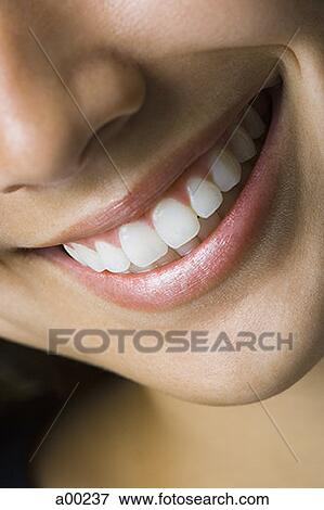 Close-up of a smiling mouth View Large Photo Image Stock Photo - Close-up of a smiling mouth. Fotosearch
