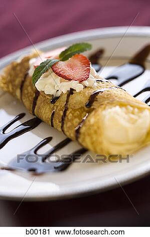 Close-up of a spring roll on a plate View Large Photo Image Stock Image - Close-up of a spring roll on a plate. Fotosearch