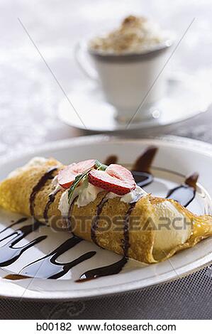 Close-up of a spring roll on a plate View Large Photo Image Stock Image - Close-up of a spring roll on a plate. Fotosearch