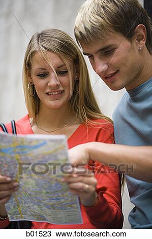 Close-up of a teenage couple looking at a map View Large Photo Image Stock Image - Close-up of a teenage couple looking at a map. Fotosearch
