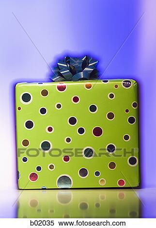 Close-up of a wrapped gift View Large Photo Image Stock Photography - Close-up of a wrapped gift. Fotosearch