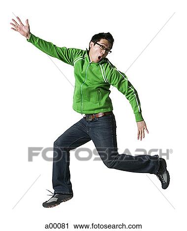 Close-up of a young Asian man jumping View Large Photo Image Stock Image - Close-up of a young Asian man jumping. Fotosearch