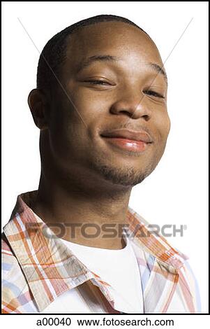 Close-up of a young black man smiling View Large Photo Image Stock Image - Close-up of a young black man smiling. Fotosearch