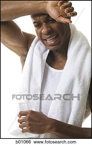 Close-up of a young man after a work out View Large Photo Image Stock Photograph - Close-up of a young man after a work out. Fotosearch