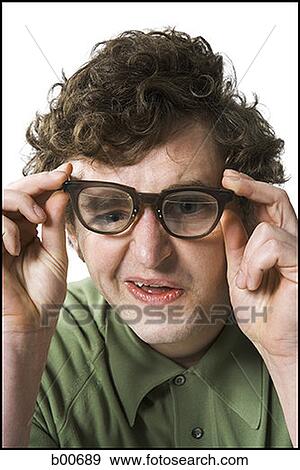 Close-up of a young man making a face View Large Photo Image Stock Photo - Close-up of a young man making a face. Fotosearch