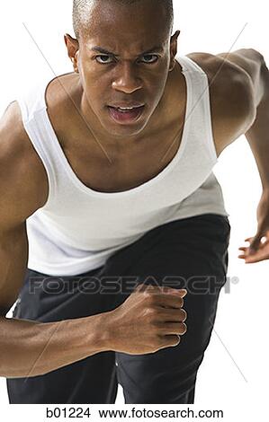 Close-up of a young man running View Large Photo Image Picture - Close-up of a young man running. Fotosearch
