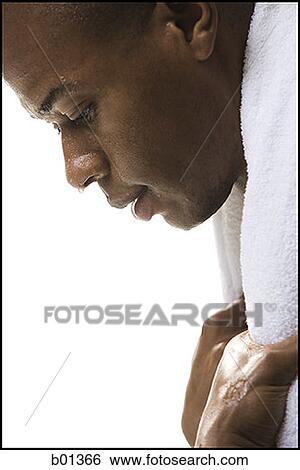 Close-up of a young man sweating after a work out View Large Photo Image Stock Photograph - Close-up of a young man sweating after a work out. Fotosearch