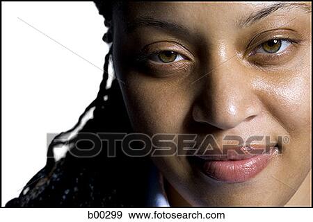 Stock Photo - Close-up of a young multi-ethnic woman smiling. Fotosearch