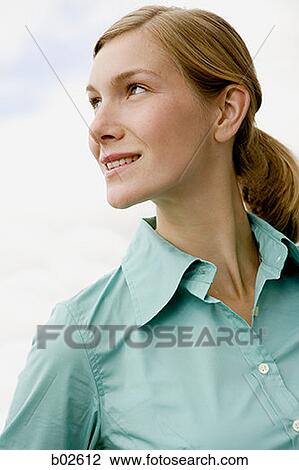 Stock Image - Close-up of a young woman looking sideways. Fotosearch