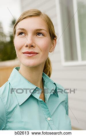 Close-up of a young woman looking up View Large Photo Image Stock Image - Close-up of a young woman looking up. Fotosearch