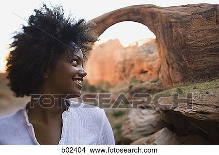 Close-up of a young woman smiling View Large Photo Image Picture - Close-up of a young woman smiling. Fotosearch