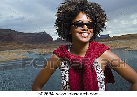 Close-up of a young woman smiling View Large Photo Image Picture - Close-up of a young woman smiling. Fotosearch