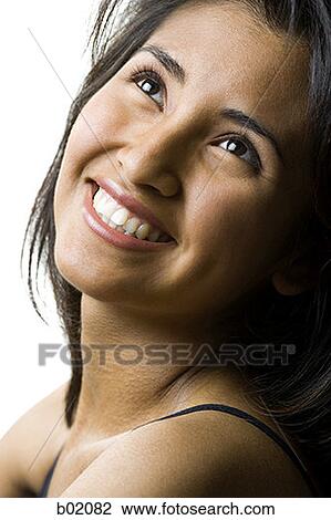 Close-up of a young woman smiling View Large Photo Image Stock Image - Close-up of a young woman smiling. Fotosearch