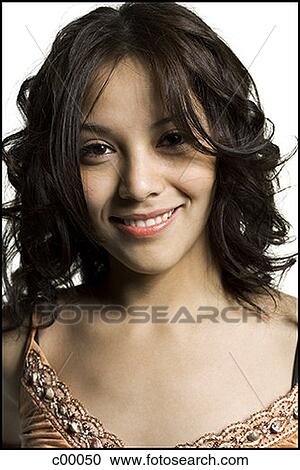 Close-up of a young woman smiling View Large Photo Image Stock Image - Close-up of a young woman smiling. Fotosearch