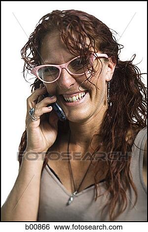 Close-up of an adult woman using a mobile phone View Large Photo Image Stock Photograph - Close-up of an adult woman using a mobile phone. Fotosearch
