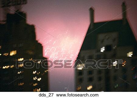 Close-up of fireworks between two buildings View Large Photo Image Stock Photo - Close-up of fireworks between two buildings. Fotosearch
