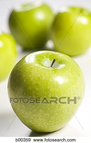 Close-up of four granny smith apples (aphis pomi) View Large Photo Image Stock Photo - Close-up of four granny smith apples (aphis pomi). Fotosearch