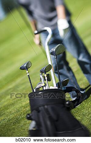 Close-up of golf clubs in a golf bag View Large Photo Image Stock Image - Close-up of golf clubs in a golf bag. Fotosearch