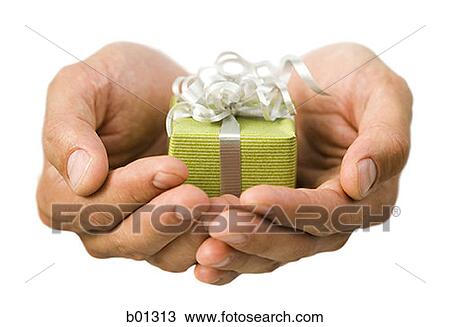 Close-up of hands holding a small gift View Large Photo Image Stock Image - Close-up of hands holding a small gift. Fotosearch