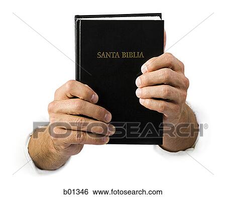Close-up of hands holding a Spanish language Bible View Large Photo Image Stock Photograph - Close-up of hands holding a Spanish language Bible. Fotosearch