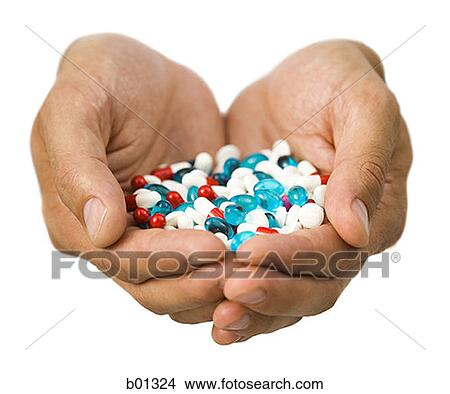 Close-up of hands holding pills View Large Photo Image Picture - Close-up of hands holding pills. Fotosearch