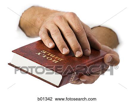 Close-up of hands holding the Bible View Large Photo Image Stock Image - Close-up of hands holding the Bible. Fotosearch