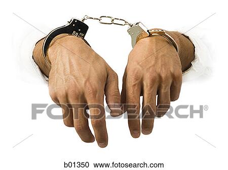 Close-up of hands in handcuffs View Large Photo Image Stock Image - Close-up of hands in handcuffs. Fotosearch