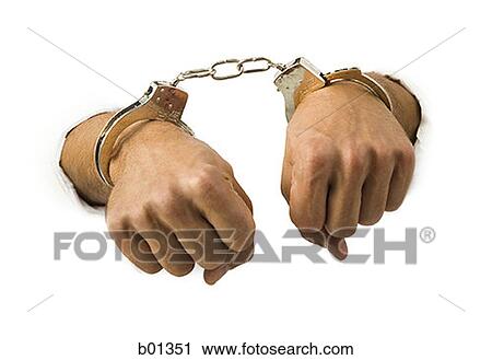 Close-up of hands in handcuffs View Large Photo Image Stock Image - Close-up of hands in handcuffs. Fotosearch