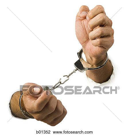 Close-up of hands trying to break out of handcuffs View Large Photo Image Stock Image - Close-up of hands trying to break out of handcuffs. Fotosearch