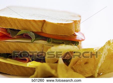 Close-up of sandwich and potato chips View Large Photo Image Stock Image - Close-up of sandwich and potato chips. Fotosearch