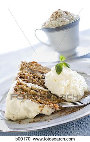 Stock Image - Close-up of slice of a cake and a fork on a plate. Fotosearch