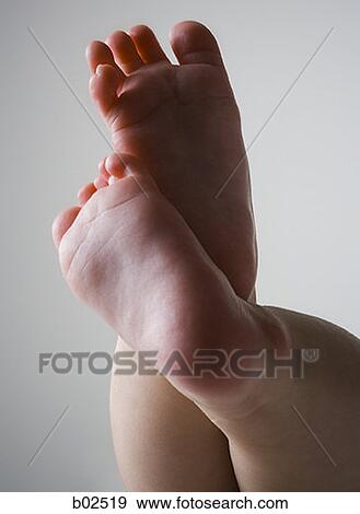 Stock Photo - Close-up of soles of a baby's feet. Fotosearch