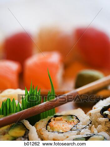 Stock Image - Close-up of sushi and chopsticks. Fotosearch