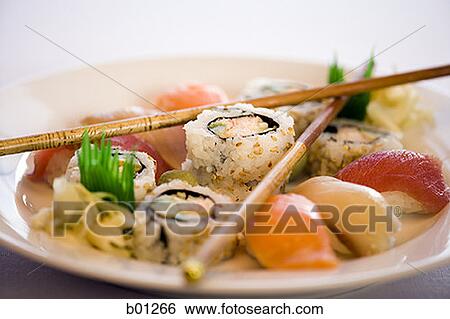 Close-up of sushi rolls on a plate View Large Photo Image Stock Photograph - Close-up of sushi rolls on a plate. Fotosearch