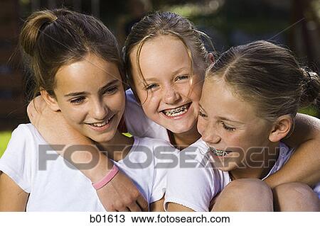 Close-up of three girls smiling View Large Photo Image Stock Image - Close-up of three girls smiling. Fotosearch