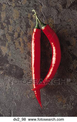 Close-up of two red chilies View Large Photo Image Stock Photo - Close-up of two red chilies. Fotosearch