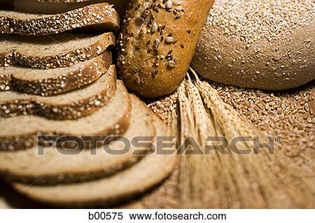 Close-up of wheat stem and slices of brown bread View Large Photo Image Stock Photography - Close-up of wheat stem and slices of brown bread. Fotosearch
