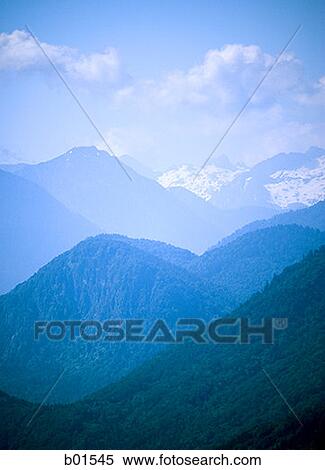 Clouds over mountains View Large Photo Image Stock Photography - Clouds over mountains. Fotosearch