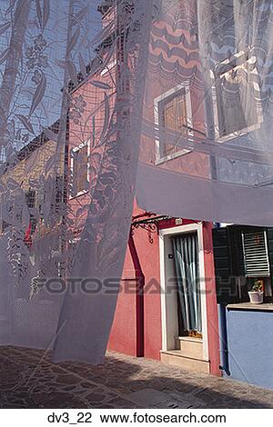 Curtain hanging in front of a building View Large Photo Image Stock Image - Curtain hanging in front of a building. Fotosearch