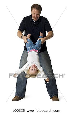 Father playing with his daughter View Large Photo Image Stock Photograph - Father playing with his daughter. Fotosearch