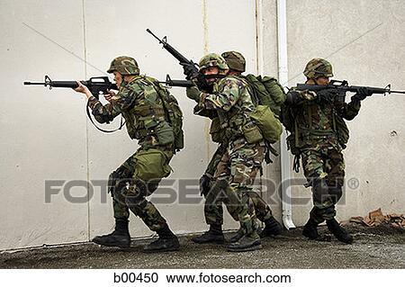 Four soldiers aiming their rifles View Large Photo Image Stock Image - Four soldiers aiming their rifles. Fotosearch