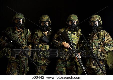 Four soldiers wearing gas masks and holding rifles View Large Photo Image Stock Image - Four soldiers wearing gas masks and holding rifles. Fotosearch