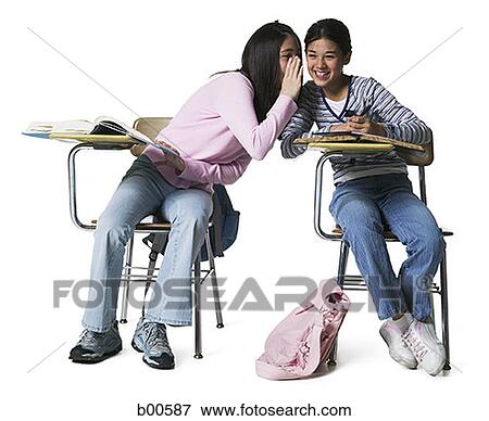 Girl whispering into a girl's ear View Large Photo Image Stock Photo - Girl whispering into a girl's ear. Fotosearch