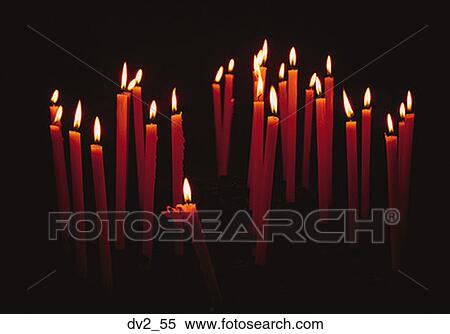 Stock Photography - Group of lit candles. Fotosearch